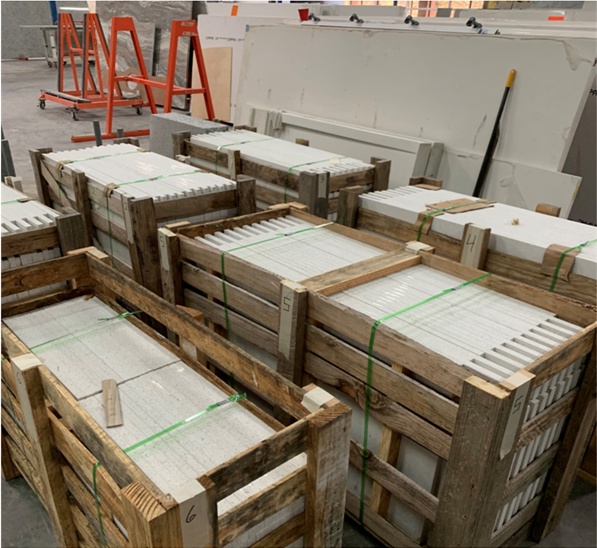 Crated countertop slabs and materials inside the Hard Surfaces facility