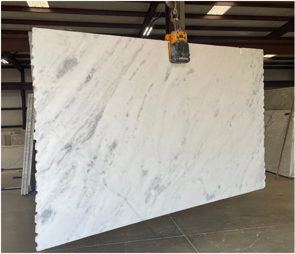 Shadow Storm marble slab with gray veining in a fabrication shop
