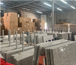 Fabricated countertop pieces organized in the Hard Surfaces shop